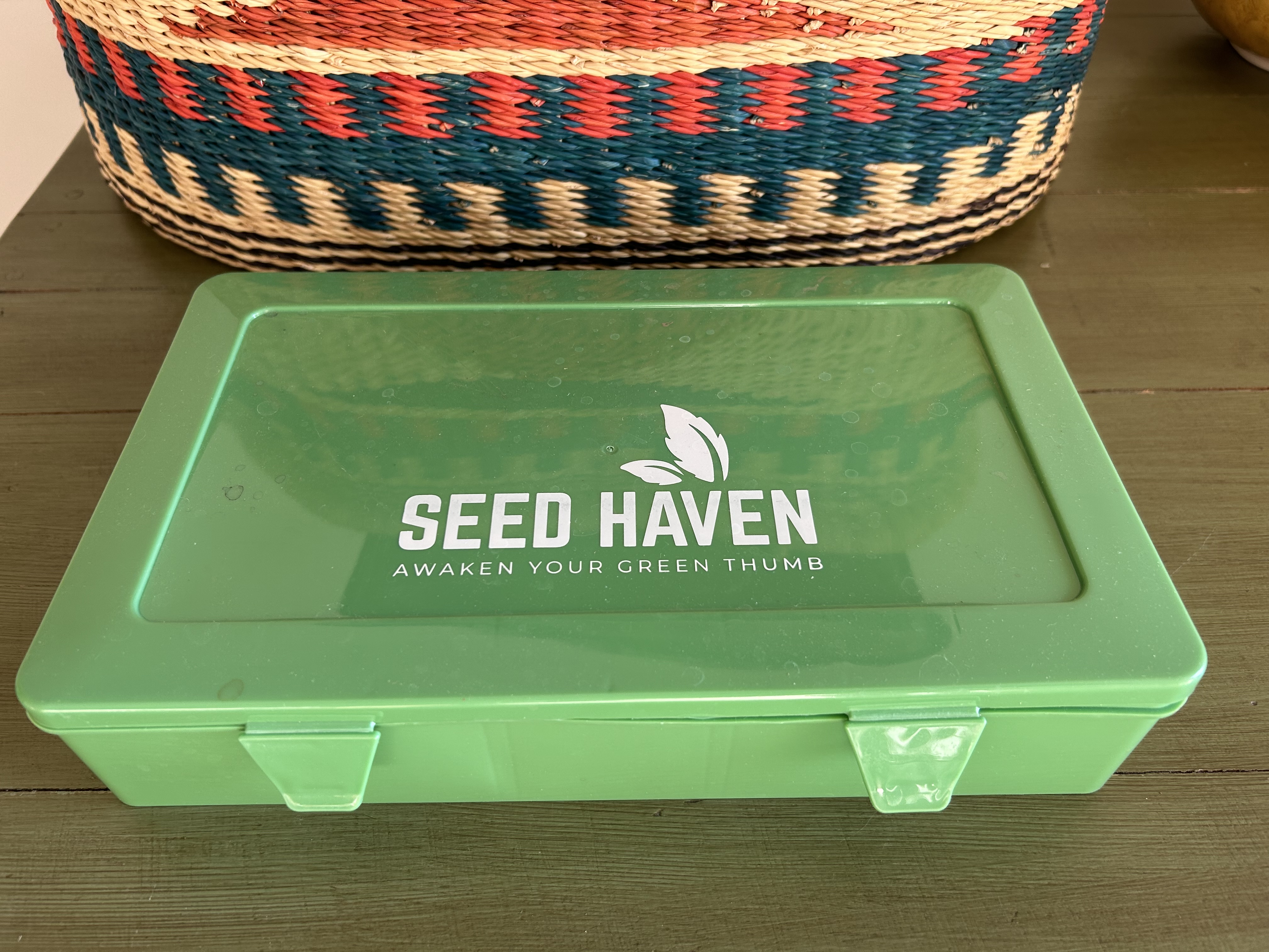 Green Seed Haven seed storage box on a table